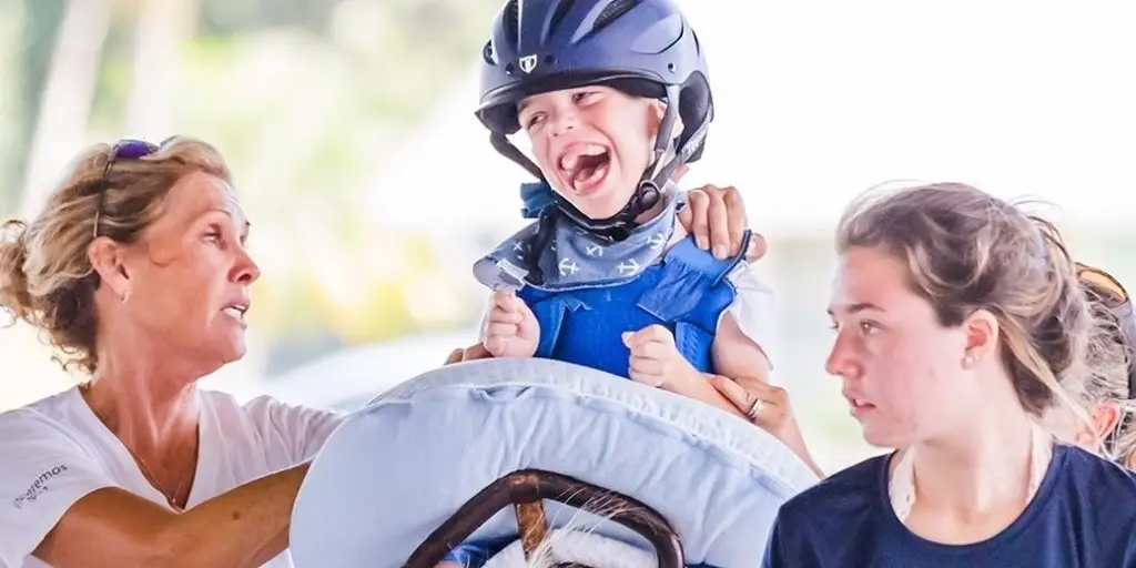 Work with kids and horses at Vinceremos Therapeutic Riding Center!