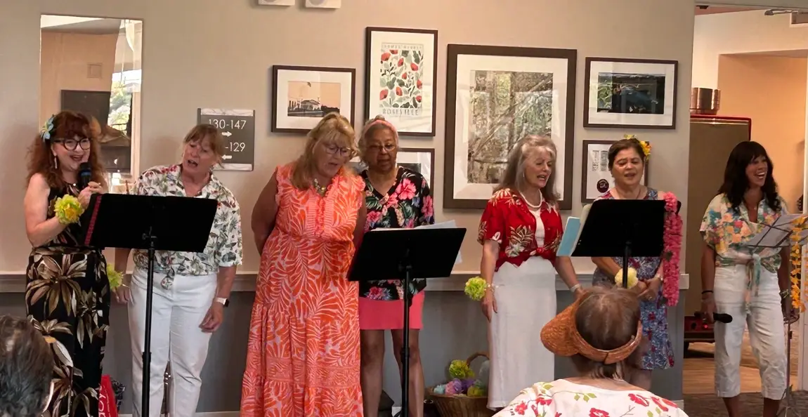 Lisa and the Idealists of Roseville, CA group sing at a local senior center.