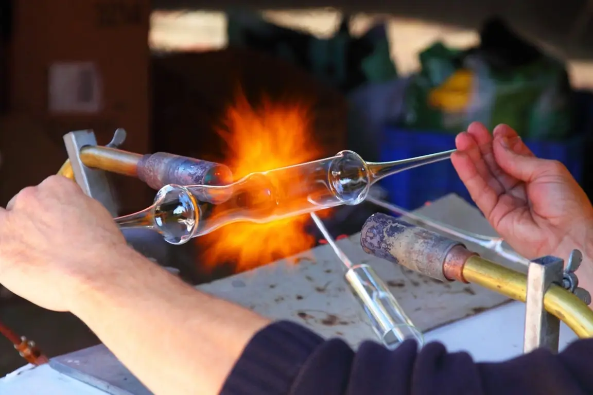 Someone glass blowing.