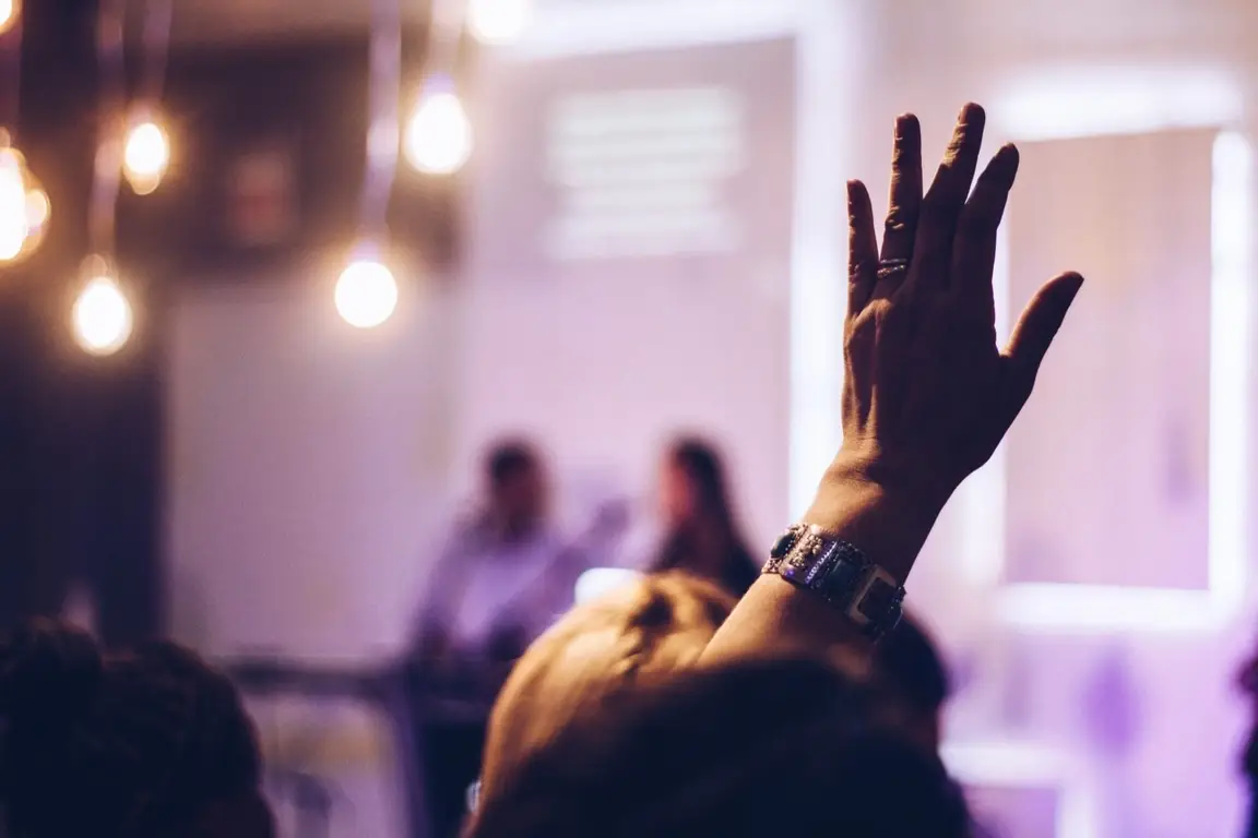 A hand raised.