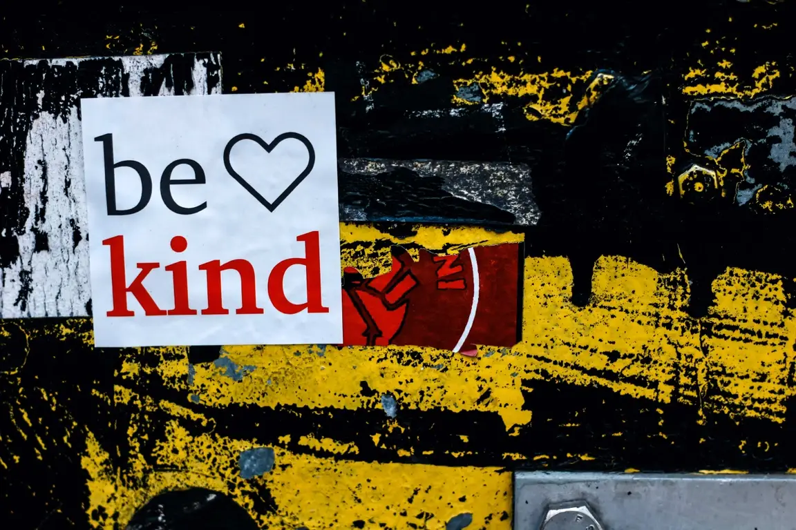 Be Kind sign on a wall
