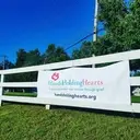 Logo of HANDS HOLDING HEARTS