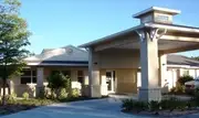 Logo of Pines of Sarasota Rehabilitation & Senior Care Community