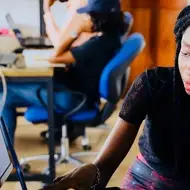 woman and man looking at computer screen