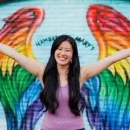 woman with her arms raised up