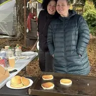 Shauna and Brittany smile at one of the many pancake pop-ups they've hosted over the last year.
