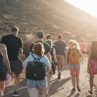 Group of people walking on a trail