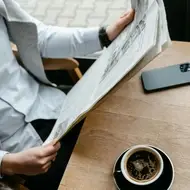 person reading a newspaper