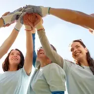A group of volunteers celebrate a job well done