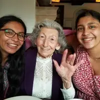 Co-founders Saffron and Shreya visit a senior citizen