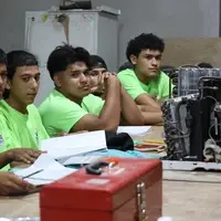 Young Honduran men learning trades