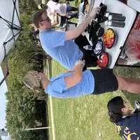 Volunteers serving food at a women's shelter