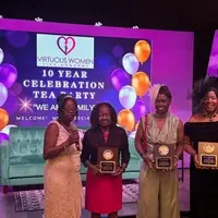 This photo is a snapshot of the annual tea party located at Stockbridge community Church, where volunteers were awarded and recognized for their contributions time and dedication. This event had prominent speakers while lunch was served, and people celebrated for their efforts in contributions.