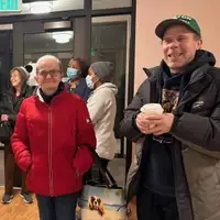 housing residents gathered with coffee