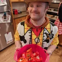 Kevin is wearing a cowboy costume for Halloween.