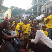 Visitors from Rotary Kenya taking a photo with some of our children and staff in our home