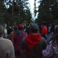 people at camp gathering in a circle