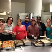 Volunteers serving dinner at Calvary Women's Services
