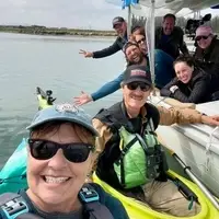 Executive Director Gena Bentall and film crew on kayaks.