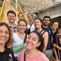 A group of volunteers in front of the classroom