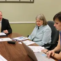Three professors in a meeting
