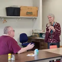 A sweet interaction with a man and woman at a senior meal