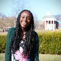 Graduate student smiling on UD campus