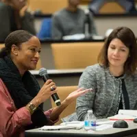 A Ford School graduate student asks questions of panelists at a Policy Talks event