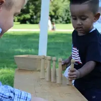 Boys playing ninepins