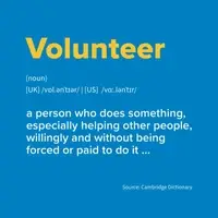 Sign that says: Volunteer,  a person who does something, especially helping other people, willingly and without being forced or paid to do it.