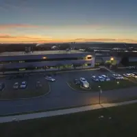 Aerial view of Health Sciences Campus George Education Center building at sunset