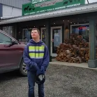 Riley standing in front of Elenbaas Country Store, where he works.