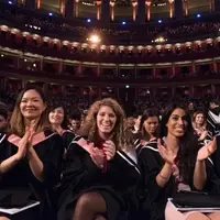 Smiling students in gowns