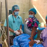Luka working in theatre with some local health personal from Ghana