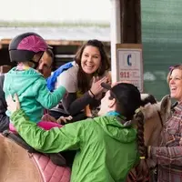 A patient on horseback during hippotherapy.
