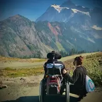 CCSL Bellingham staff and individuals we support are posing in a parking lot at Mt. Baker.