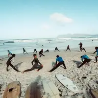 Children warming up on the beach