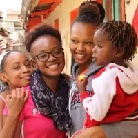 Visitors interacting with a child at smile community centre