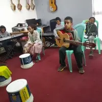 After school students learning to make music together
