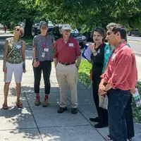Restore Mass Ave  walking tour of trees on sidewalk by 2443 Massachusetts Ave