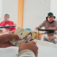 A group of women is taking part in a group session talking about trauma
