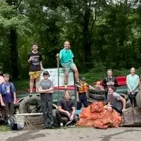 College students join together on their summer break to clean up the river and land near the river