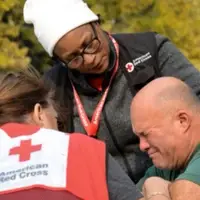 Red Cross volunteers providing emotional comfort.