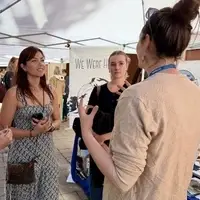 Team members engaging with visitors at a community outreach event