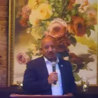 Lawrence Mayor Brian DePeña addressing guests