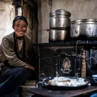 Loba woman in Mustang prepares traditional Tibetan meal