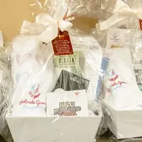 Packages for NICU including blanket, gift card, and milestone cards.
