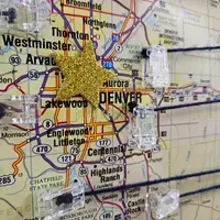 Close up of map of Colorado with a giant gold star for Denver