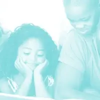A mother (left), two children (center) and father (right) read together.