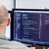 Image of Urban Insight team member Lehel programming